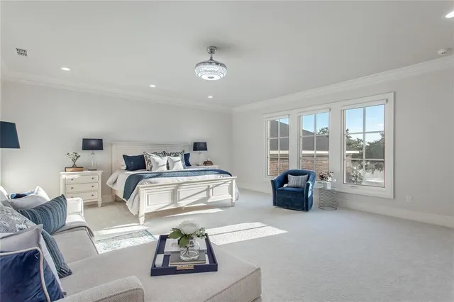 a spacious bathroom with a shower sink and mirror