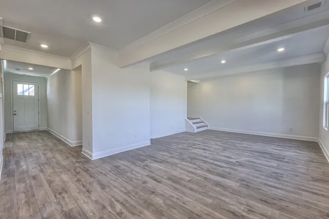 a view of a kitchen with a sink and a refrigerator