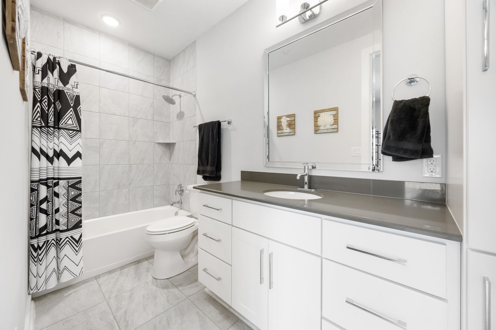 1417 Kramer Lane, Unit 14 Austin, TX 78758 - Photo 6 of 33 Bathroom with vanity and shower / bathtub combination with curtain