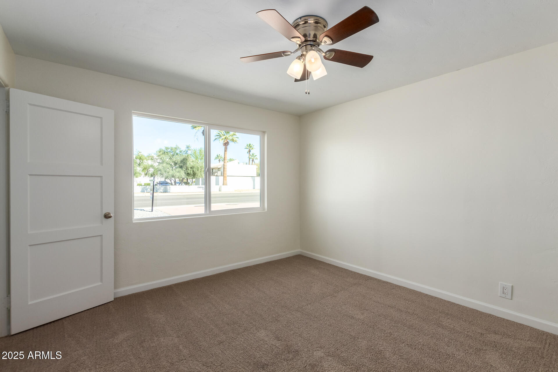 1401 East Osborn Road Phoenix, AZ 85014 - Photo 15 of 36 an empty room with a window