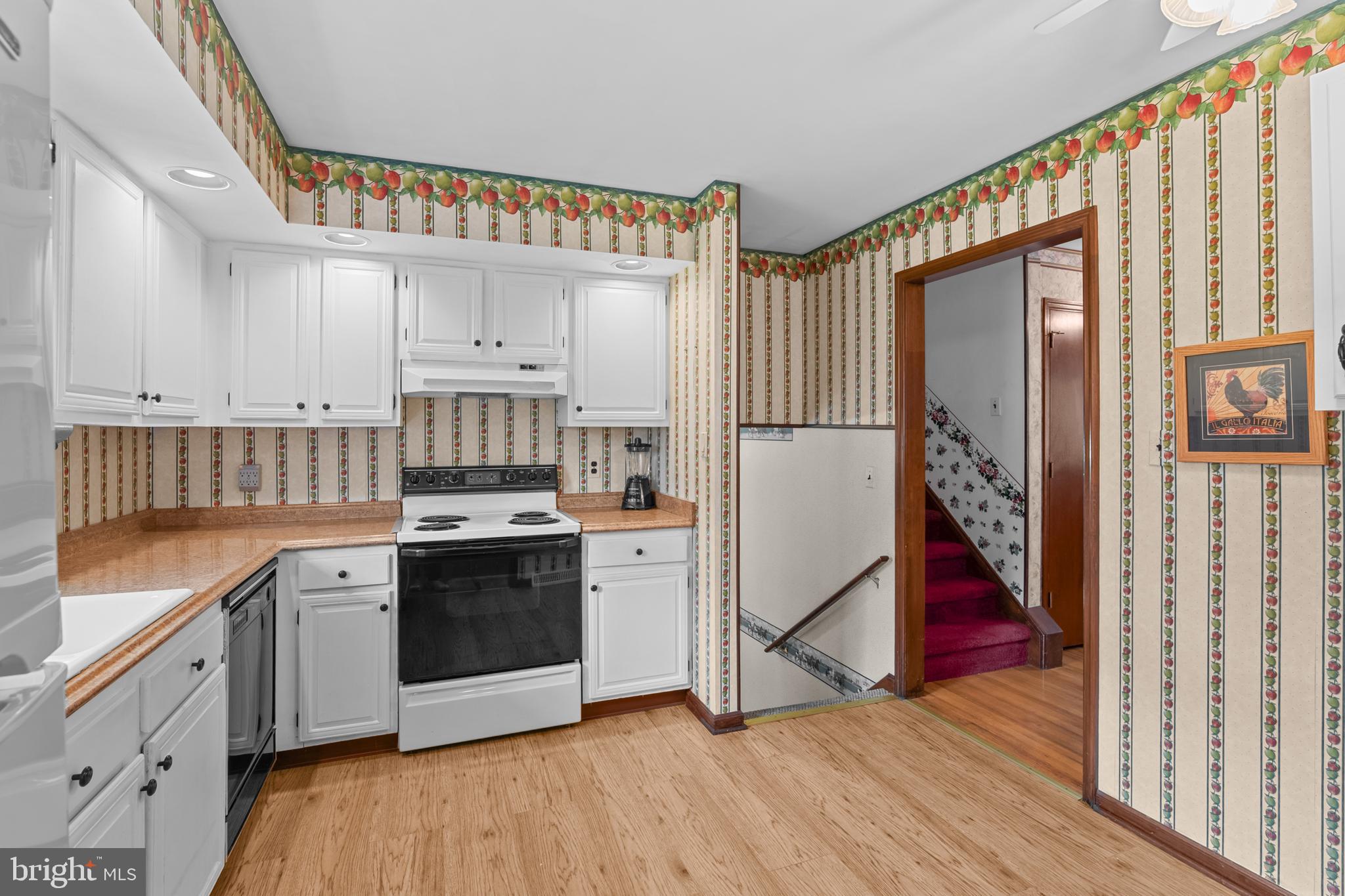 30 Stardust Drive Newark, DE 19702 - Photo 23 of 53 a kitchen with stainless steel appliances granite countertop a refrigerator a stove and a wooden floors
