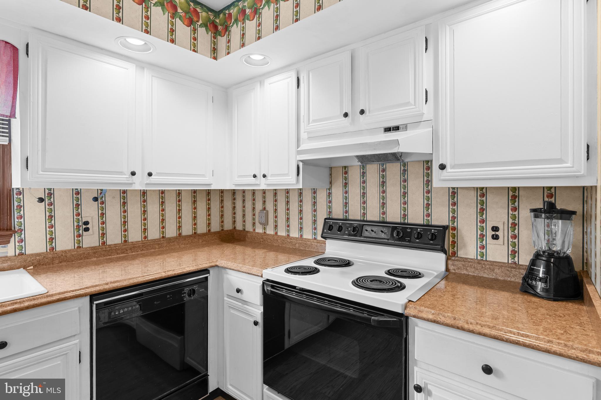 30 Stardust Drive Newark, DE 19702 - Photo 24 of 53 a kitchen with granite countertop a stove sink and cabinets