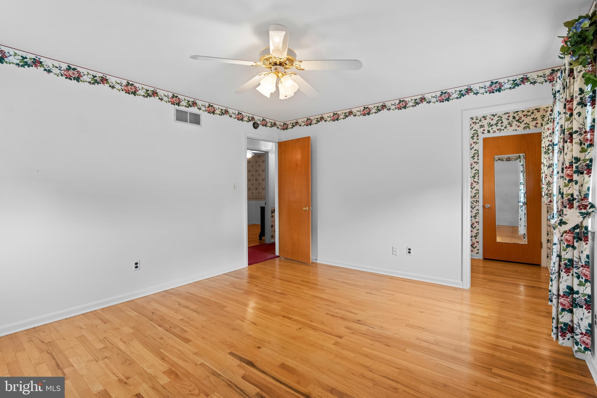 30 Stardust Drive Newark, DE 19702 - Photo 35 of 53 a view of a room with wooden floor and chandelier