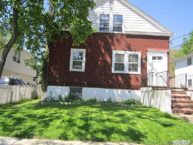 83 Edgewood Road Port Washington, NY 11050 - Photo 1 of 1 a view of house with backyard