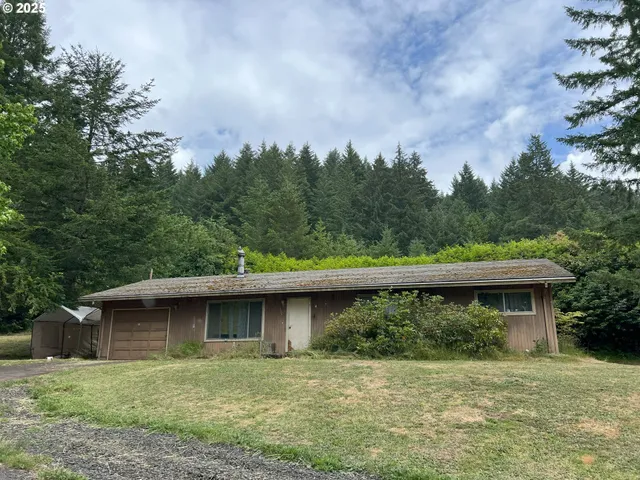 aerial view of a house with a yard
