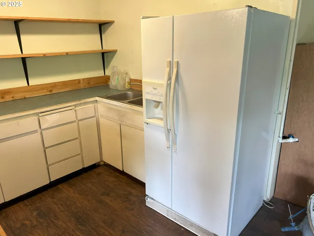 a view of a kitchen with appliances