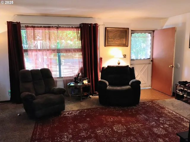 a living room with furniture and a window