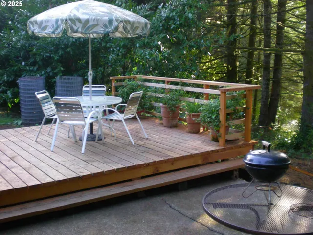 a view of outdoor sitting area with furniture and umbrella