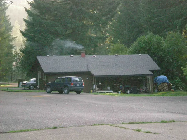 a front view of a house with a yard and a garage