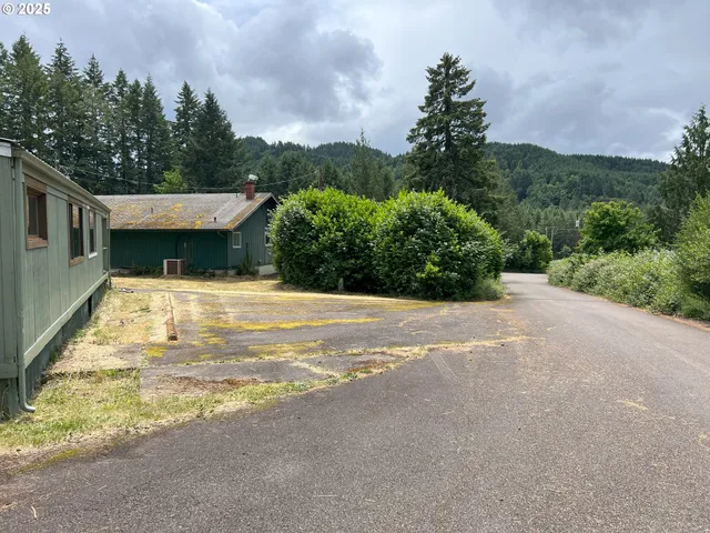 a view of fountain in front of a house