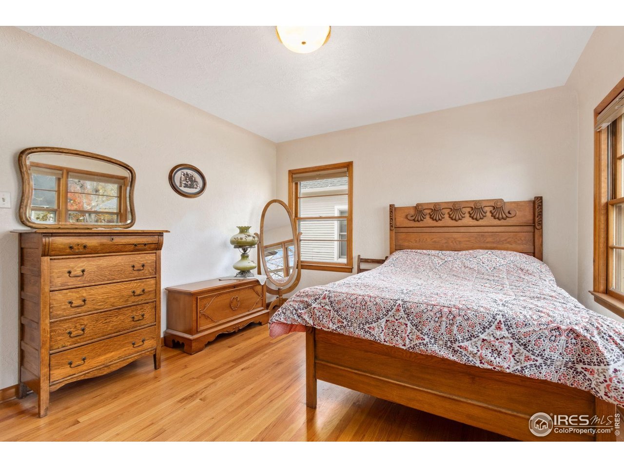 805 Walnut Street Windsor, CO 80550 - Photo 14 of 36 a bedroom with a bed and a table