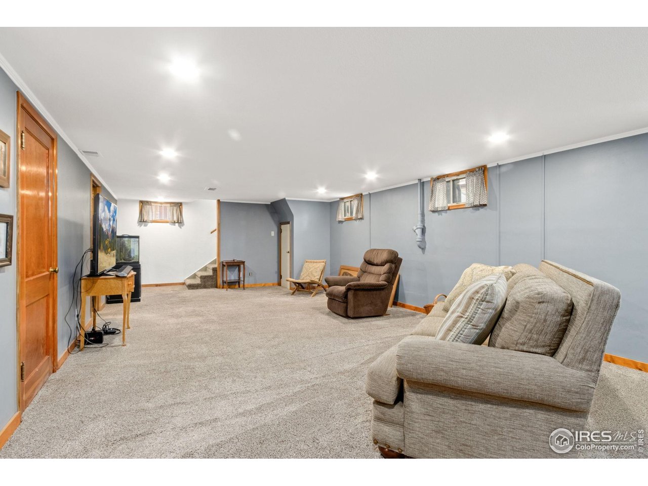 805 Walnut Street Windsor, CO 80550 - Photo 19 of 36 a living room with furniture and a couch
