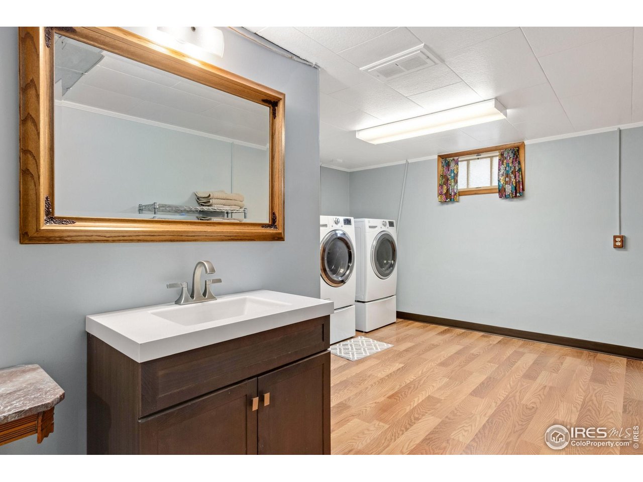 805 Walnut Street Windsor, CO 80550 - Photo 21 of 36 a bathroom with a sink and a mirror