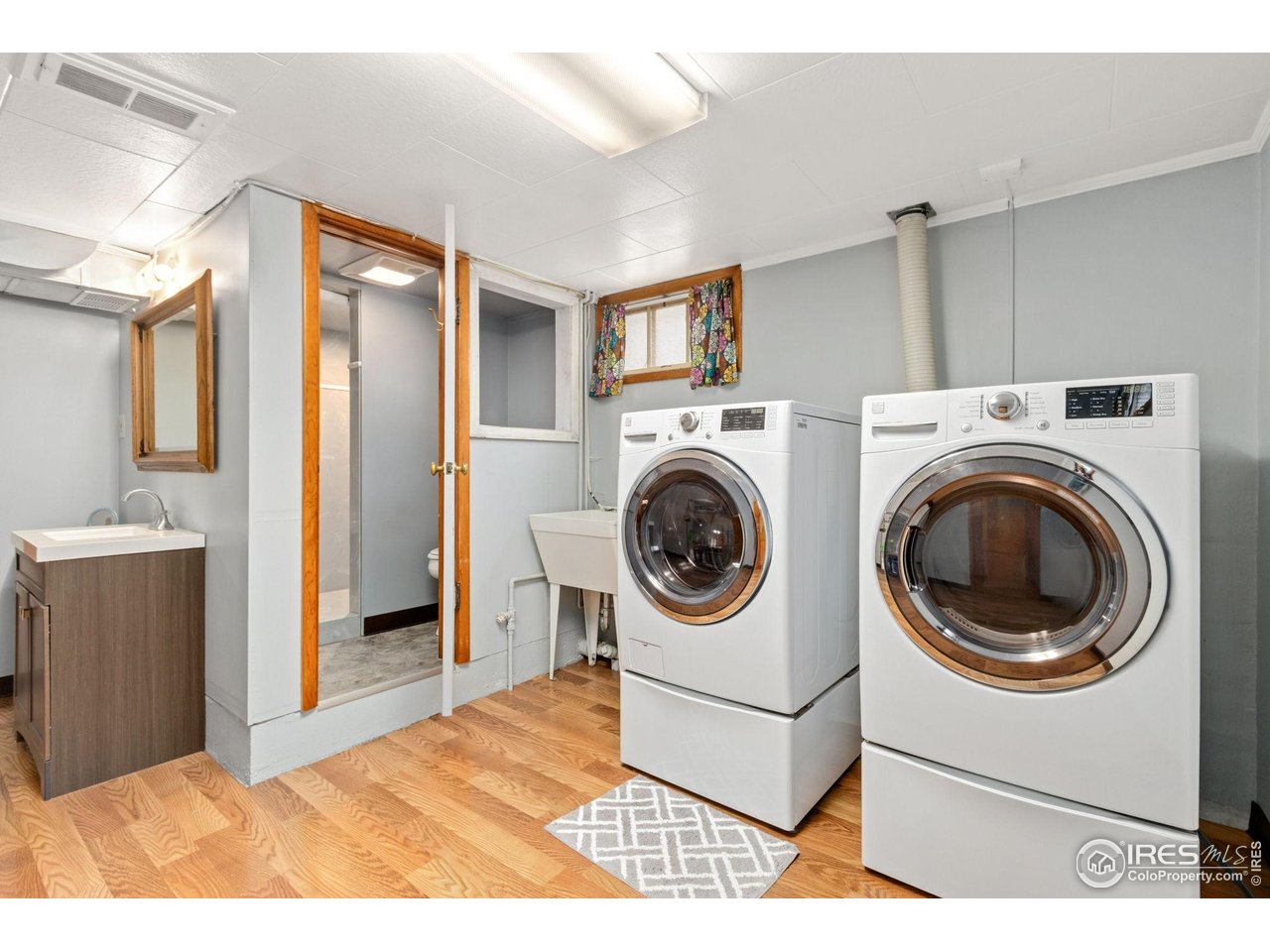 805 Walnut Street Windsor, CO 80550 - Photo 22 of 36 a view of a hallway with washer and dryer