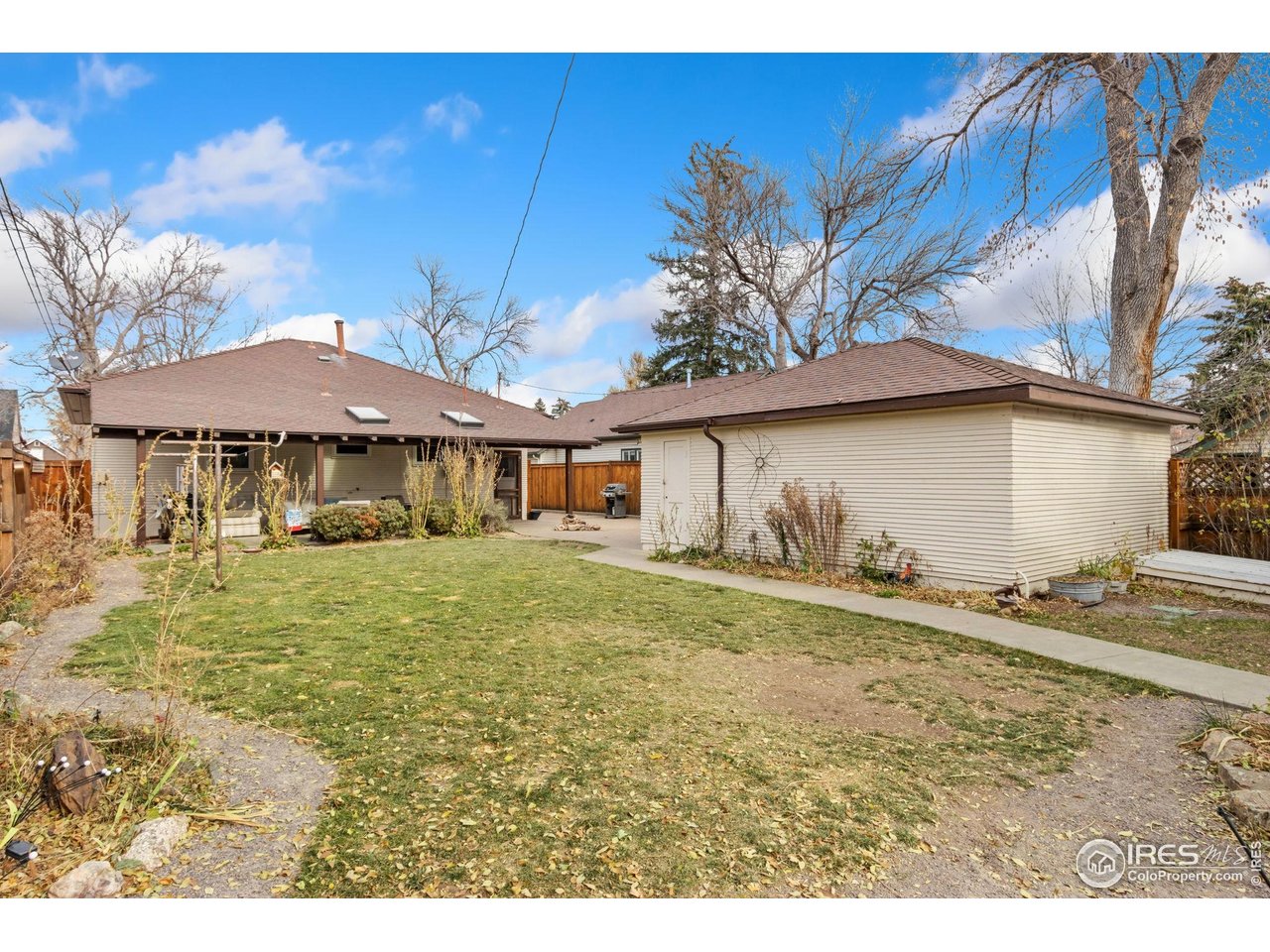 805 Walnut Street Windsor, CO 80550 - Photo 27 of 36 a view of a house with a yard