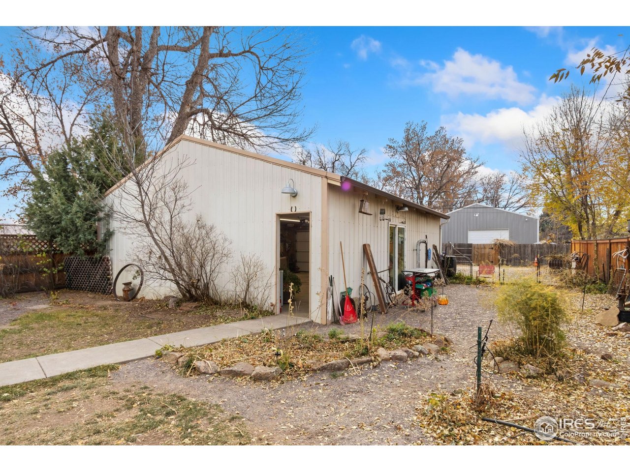 805 Walnut Street Windsor, CO 80550 - Photo 28 of 36 a view of a dirt road with a building