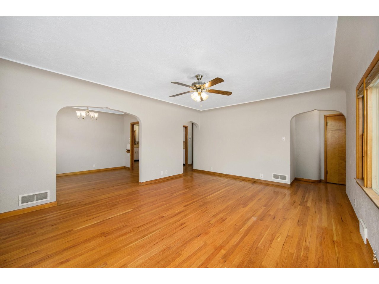 805 Walnut Street Windsor, CO 80550 - Photo 6 of 36 a view of empty room with wooden floor