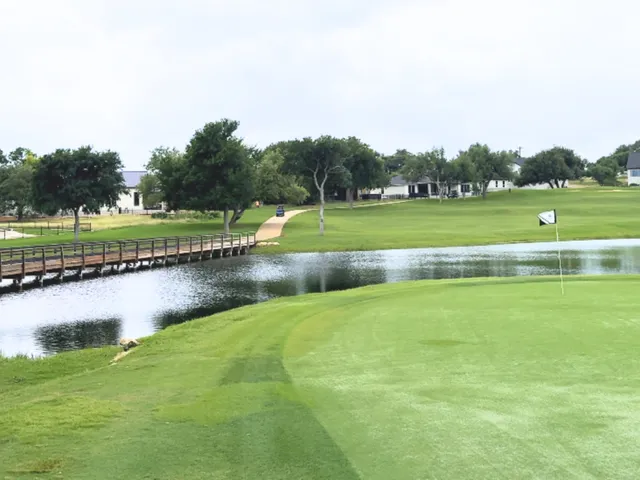 a view of a golf course with a lake