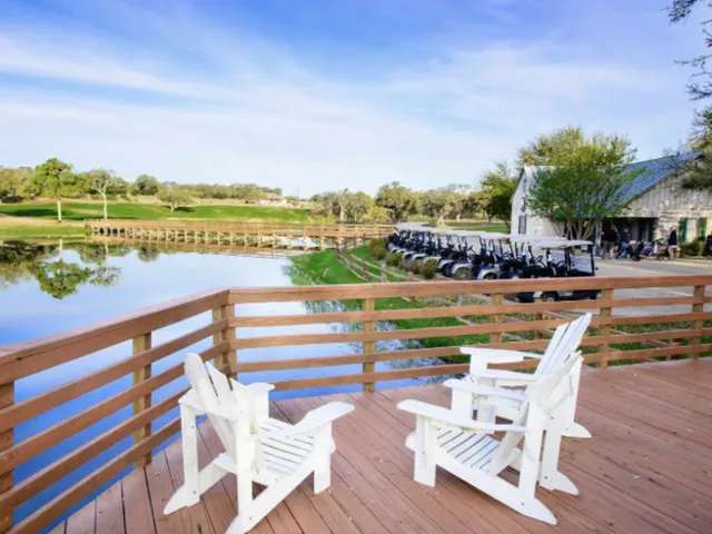 a view of swimming pool with outdoor seating and city view