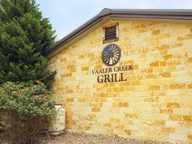 a blue sign on the side of a building