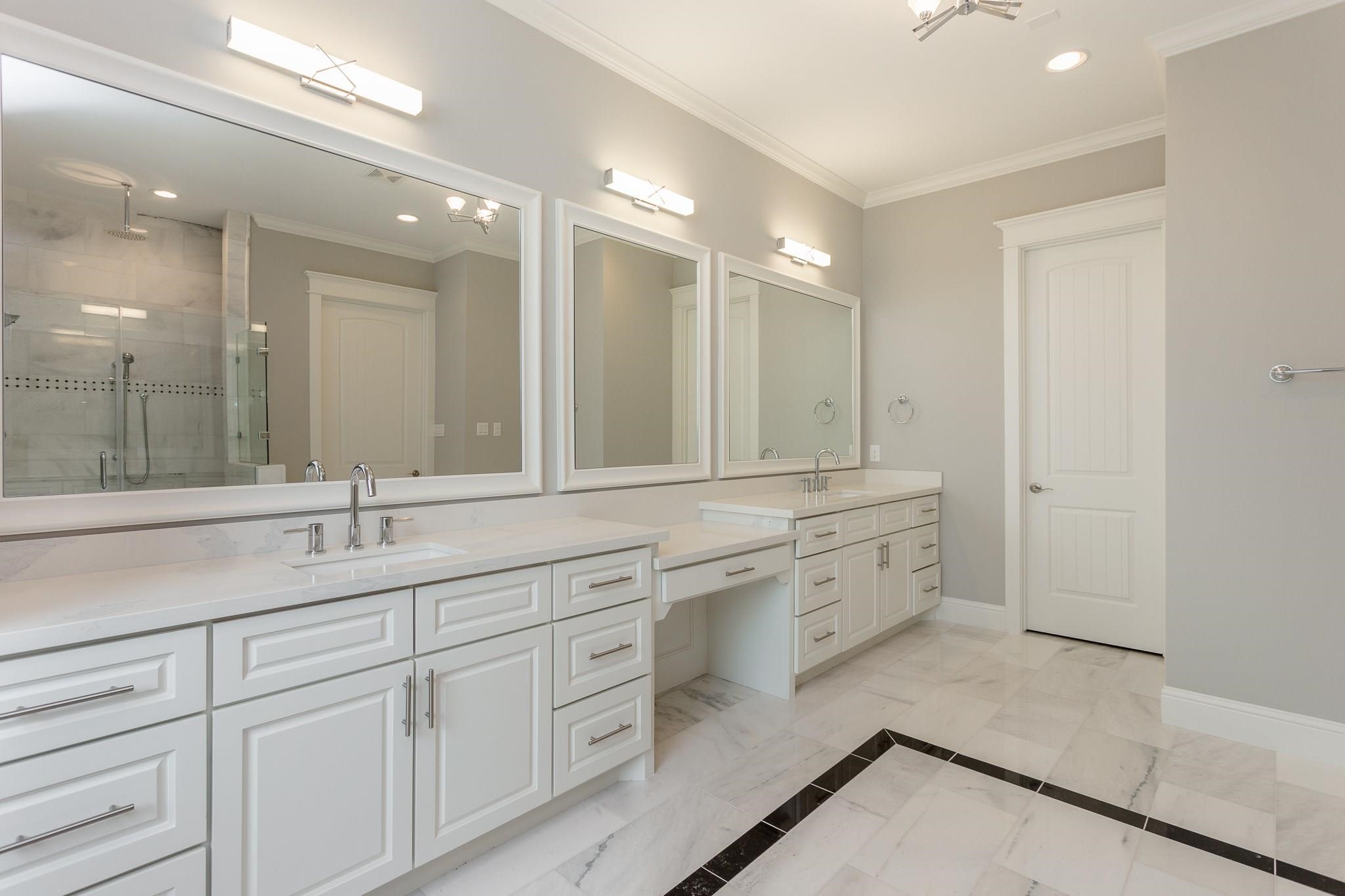 2035 Sheridan Street, Unit A Houston, TX 77030 - Photo 20 of 41 a bathroom with a sink double vanity and a mirror