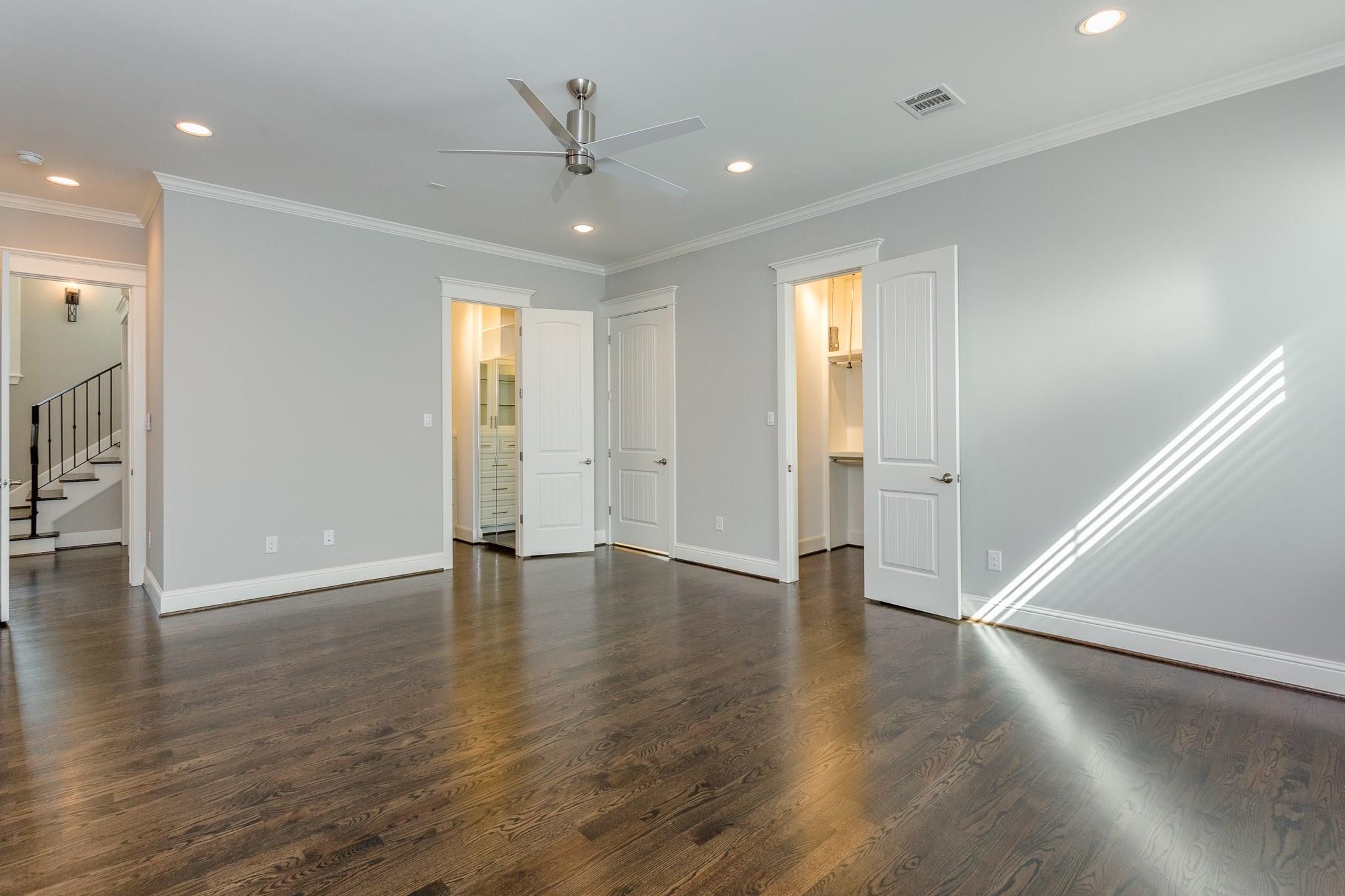 2035 Sheridan Street, Unit A Houston, TX 77030 - Photo 21 of 41 a view of an empty room with wooden floor and a window