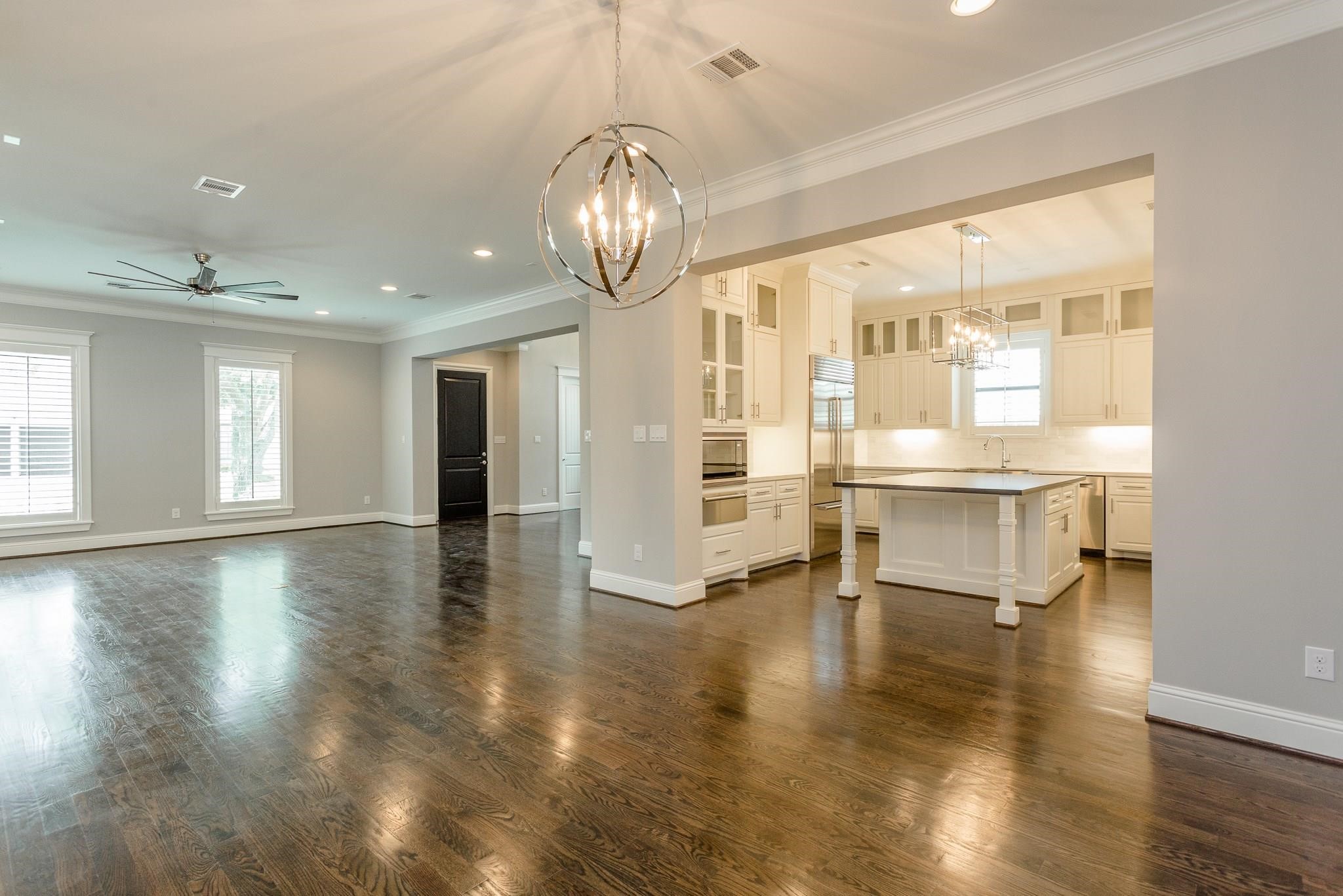 2035 Sheridan Street, Unit A Houston, TX 77030 - Photo 10 of 41 a view of empty room with wooden floor and fan