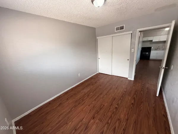 a view of hallway with wooden floor