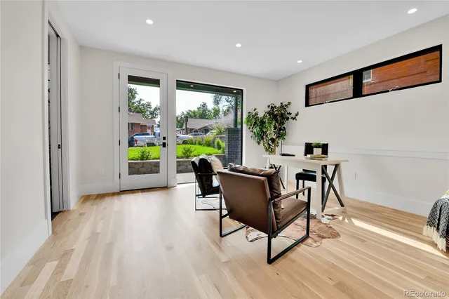 a view of a dining room with furniture and a window