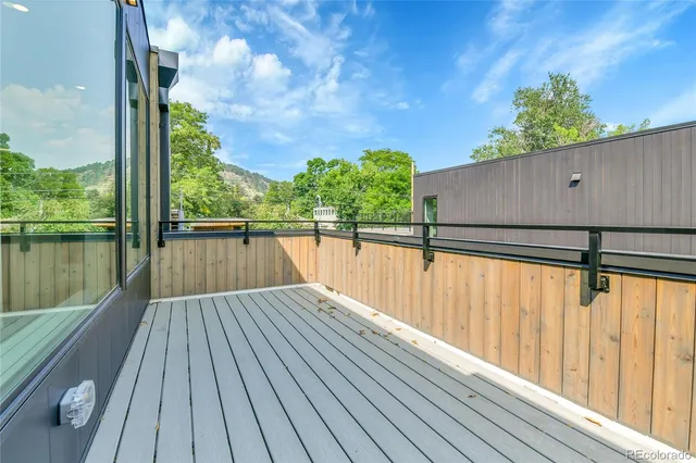 a view of outdoor space with wooden floor