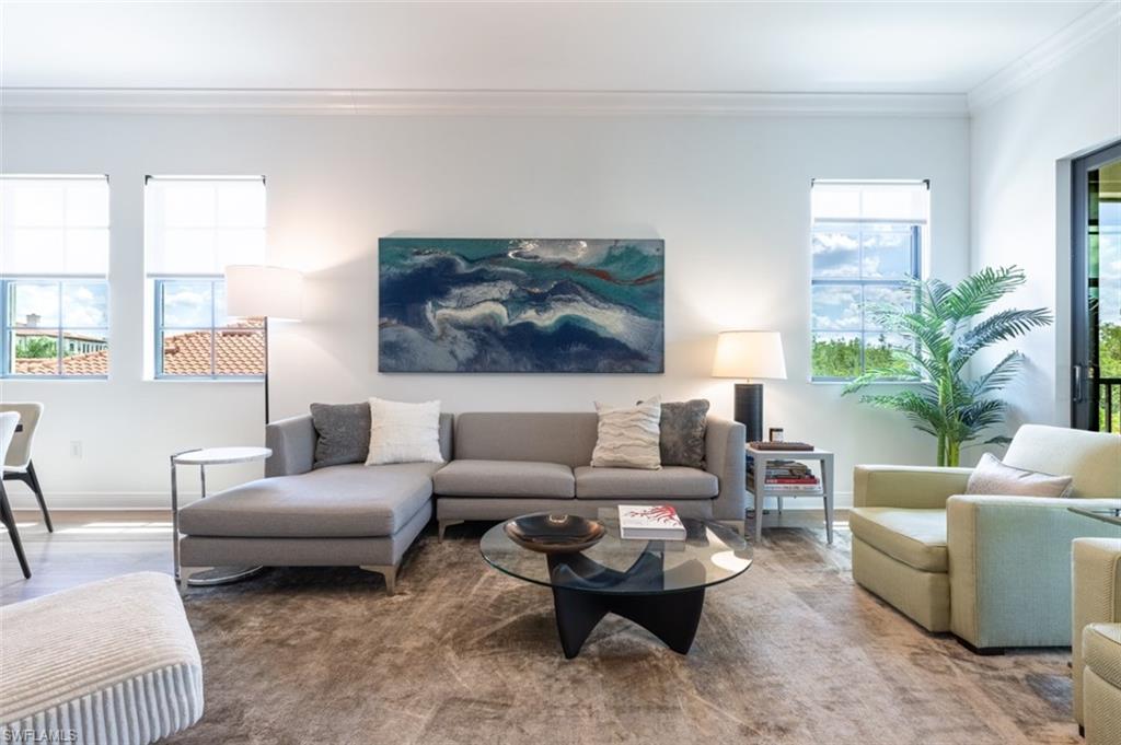 16360 Viansa Way, Unit 8201 Naples, FL 34110 - Photo 11 of 35 a living room with furniture and a potted plant