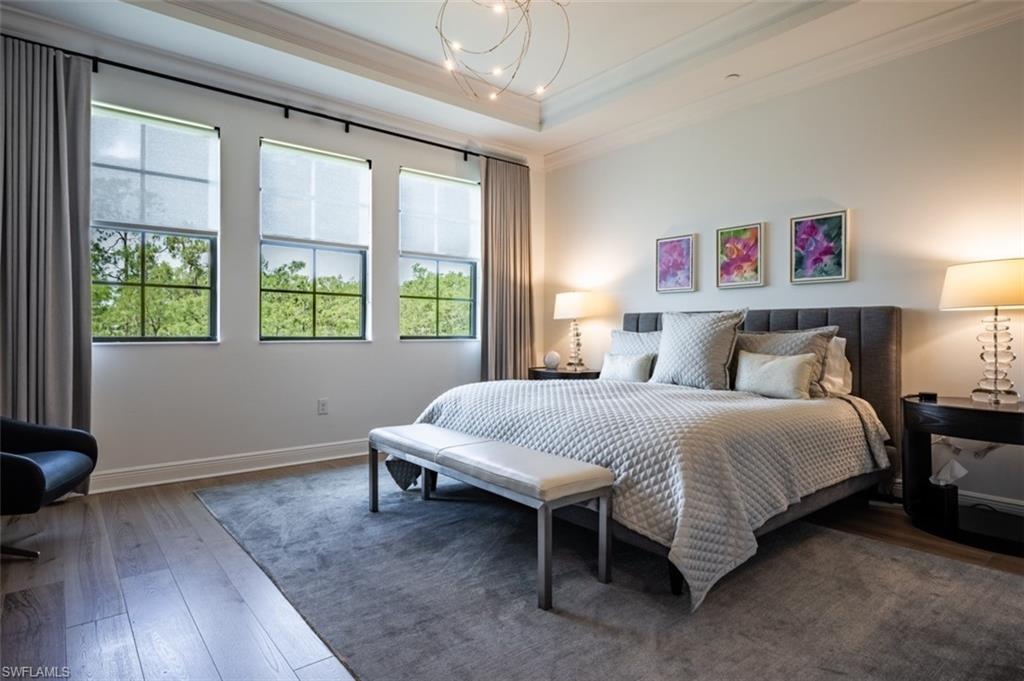 16360 Viansa Way, Unit 8201 Naples, FL 34110 - Photo 12 of 35 a bedroom with a bed and a window