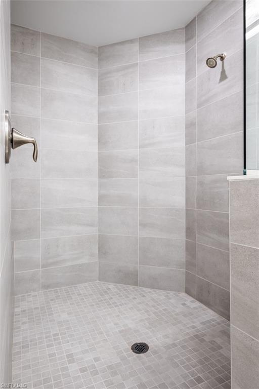16360 Viansa Way, Unit 8201 Naples, FL 34110 - Photo 16 of 35 a bathroom with a shower