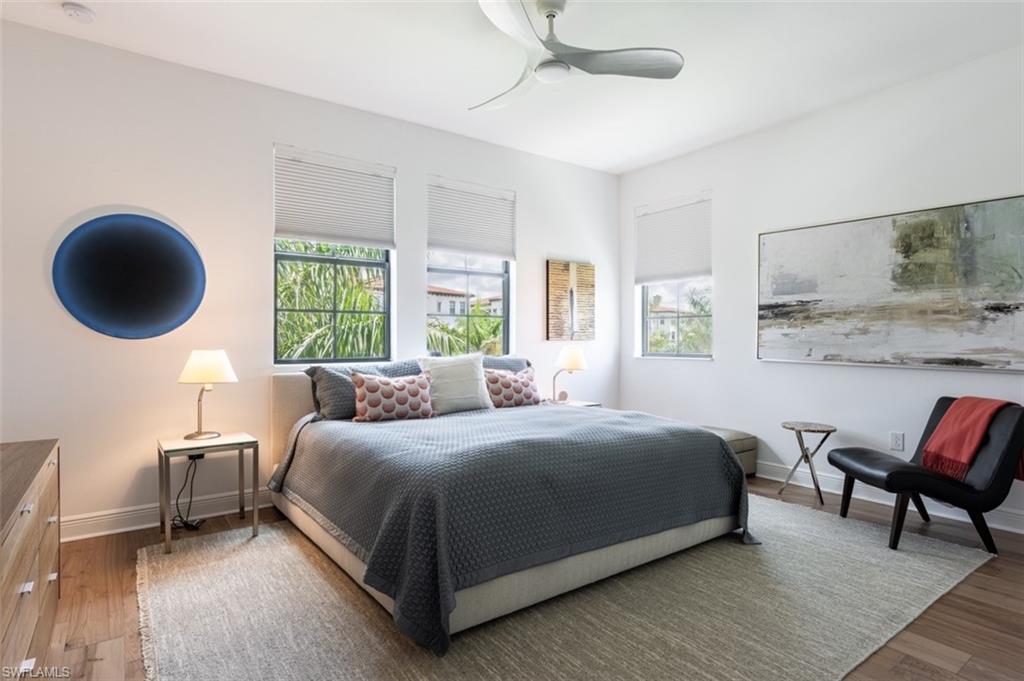 16360 Viansa Way, Unit 8201 Naples, FL 34110 - Photo 25 of 35 a bedroom with a bed and a window