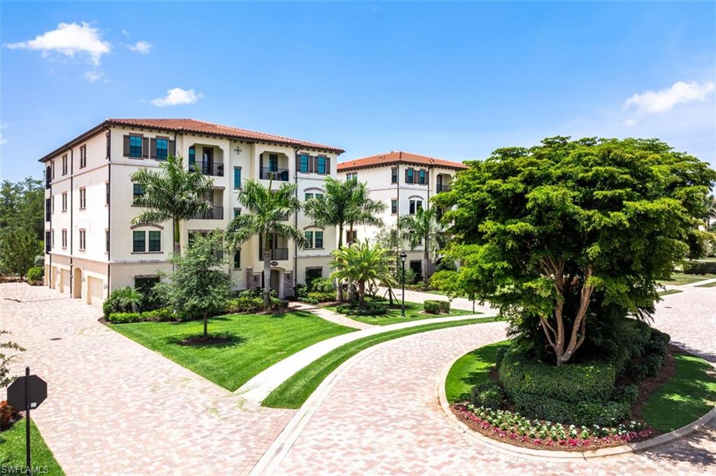 16360 Viansa Way, Unit 8201 Naples, FL 34110 - Photo 32 of 35 a house view with a garden space