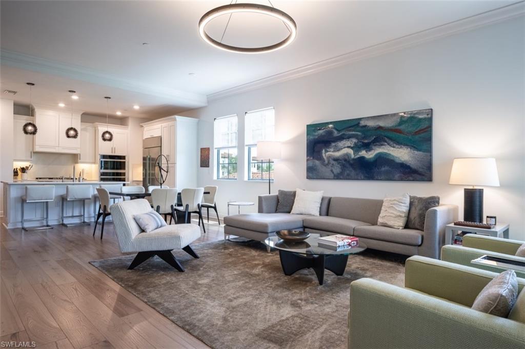 16360 Viansa Way, Unit 8201 Naples, FL 34110 - Photo 9 of 35 a living room with furniture and a large window