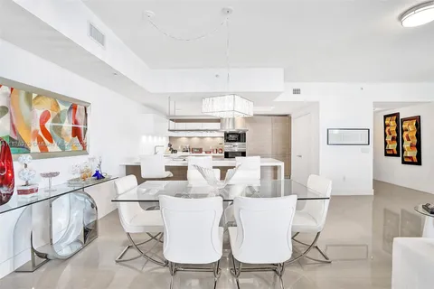 a kitchen with cabinets appliances and a sink