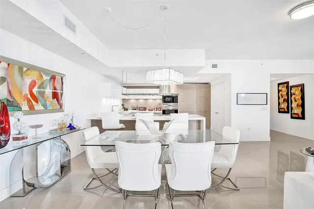 a kitchen with cabinets appliances and a sink