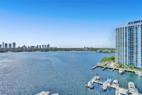 a kitchen with granite countertop white cabinets stainless steel appliances and sink