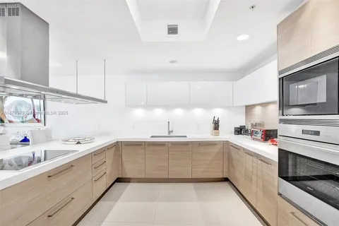 a kitchen with stainless steel appliances cabinets and a kitchen counter top