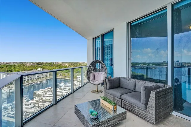 a spacious bathroom with a granite countertop sink a mirror a bathtub and shower