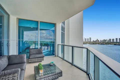 a balcony with furniture and city view