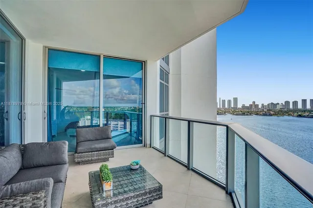 a balcony with furniture and city view