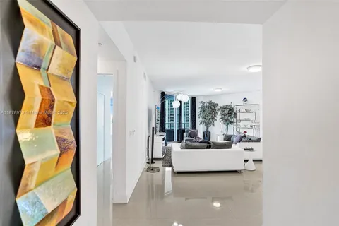 a living room with a couch and a large window