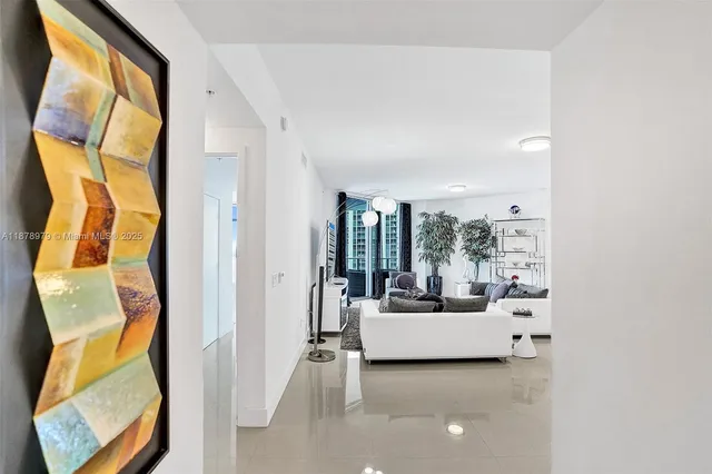 a living room with a couch and a large window