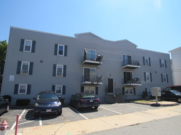 526 Third Street, Unit 4 Fall River, MA 02721 - Photo 1 of 11 a front view of a house with cars parked