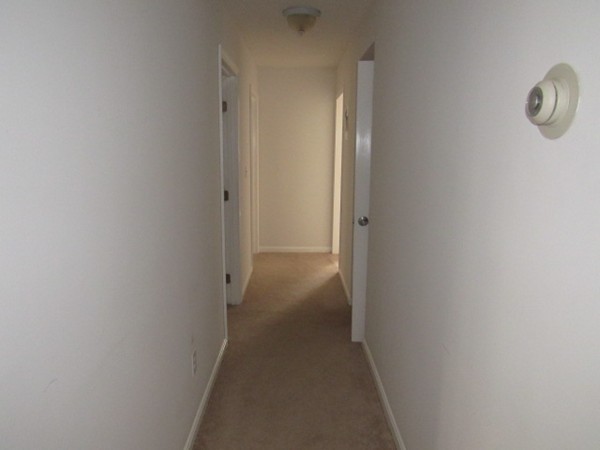 526 Third Street, Unit 4 Fall River, MA 02721 - Photo 3 of 11 a view of a hallway with wooden floor