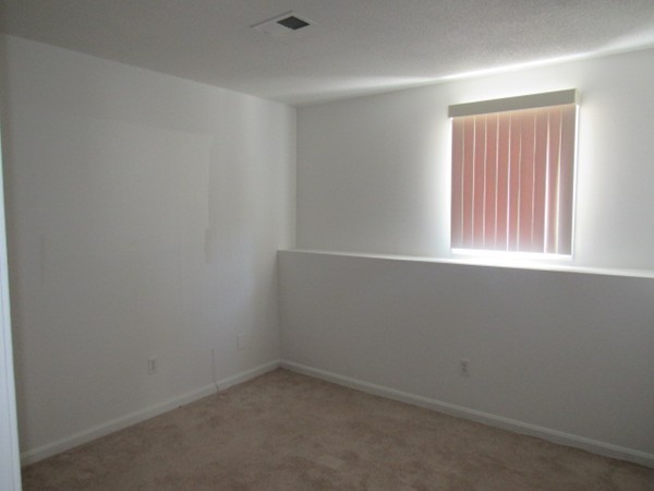 526 Third Street, Unit 4 Fall River, MA 02721 - Photo 6 of 11 an empty room with a window