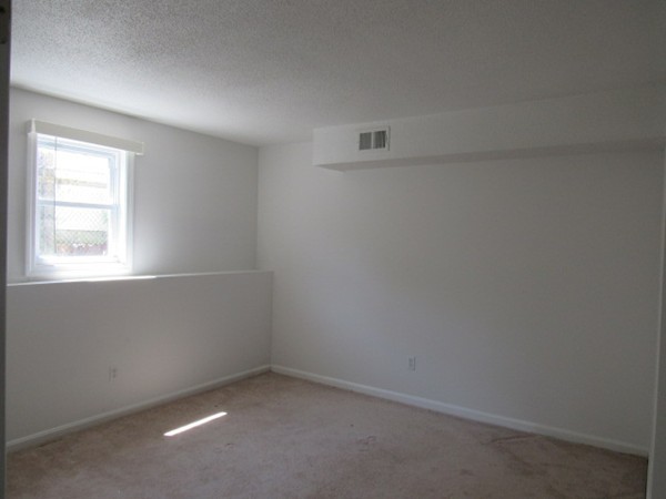 526 Third Street, Unit 4 Fall River, MA 02721 - Photo 10 of 11 an empty room with a window