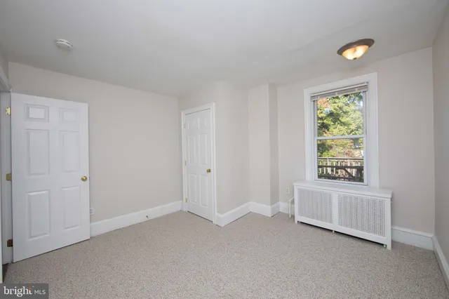 a view of an empty room and window